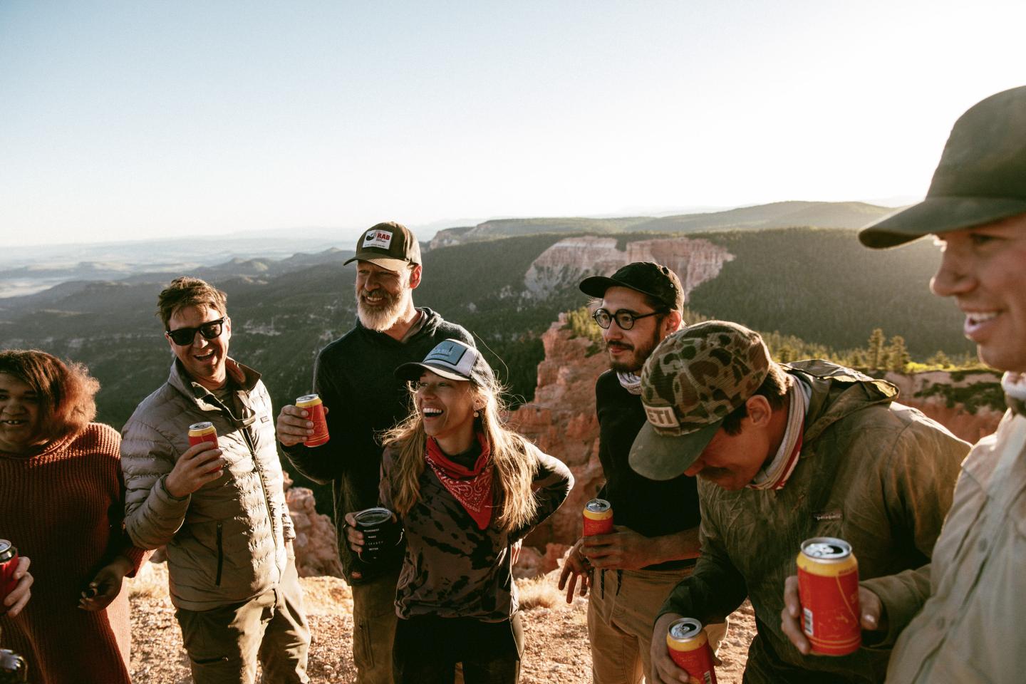 Group of friends enjoyinh drinks on a mountain