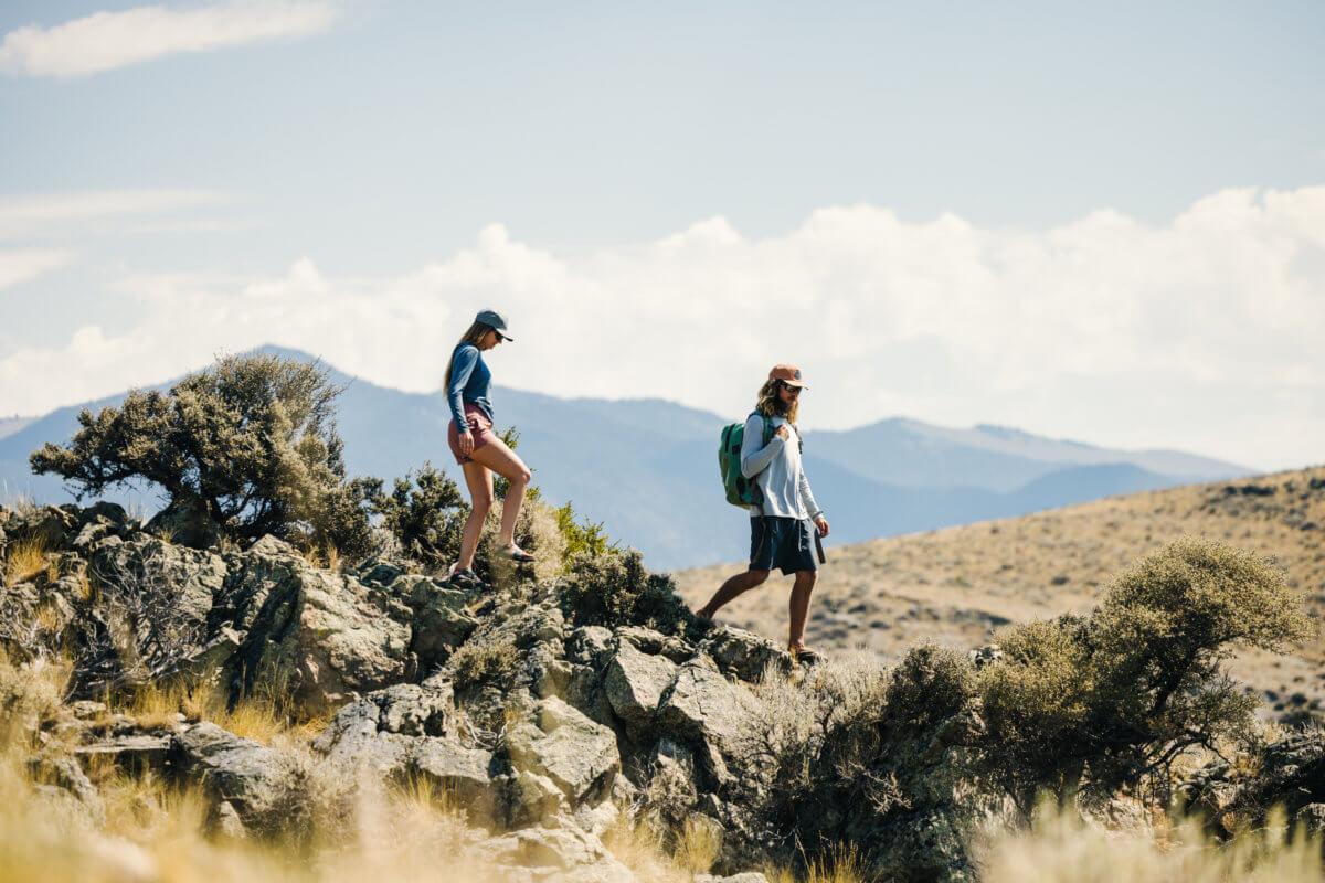 Two people hiking through rocky terrain