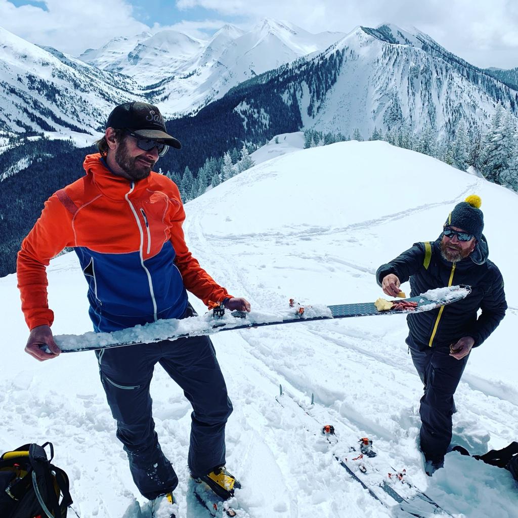 People serving snacks from a ski