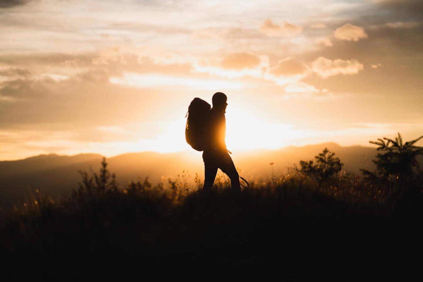 A silhouette of a hiker