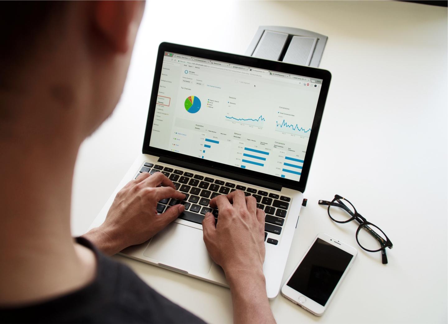 A person viewing analytics on a laptop