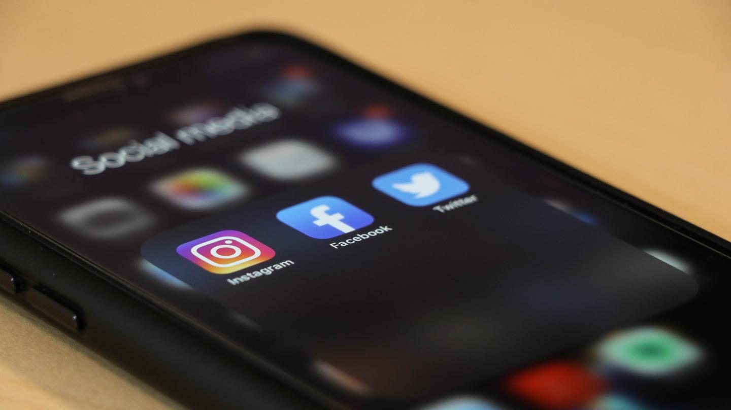 A phone showing social media apps