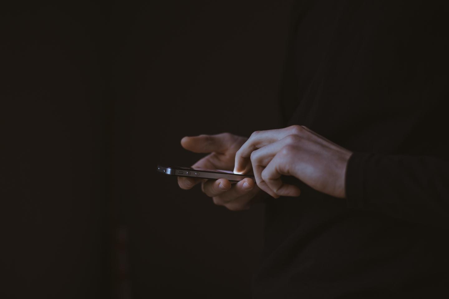Hands holding a phone