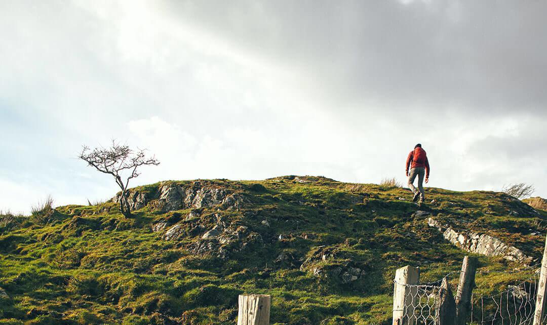 A person hiking up a hill