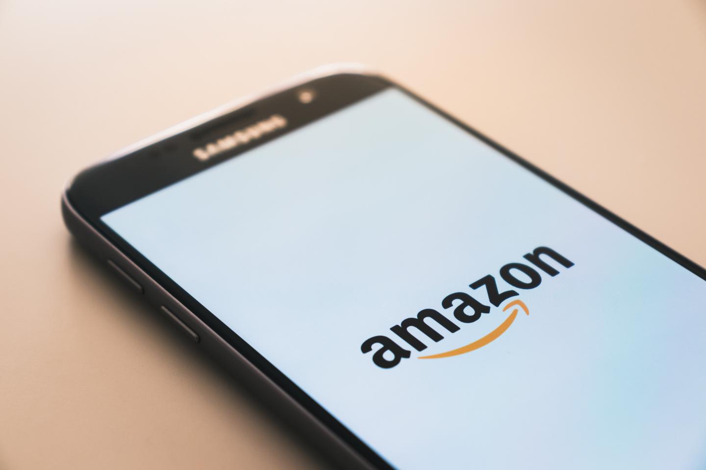 A phone screen showing an Amazon logo