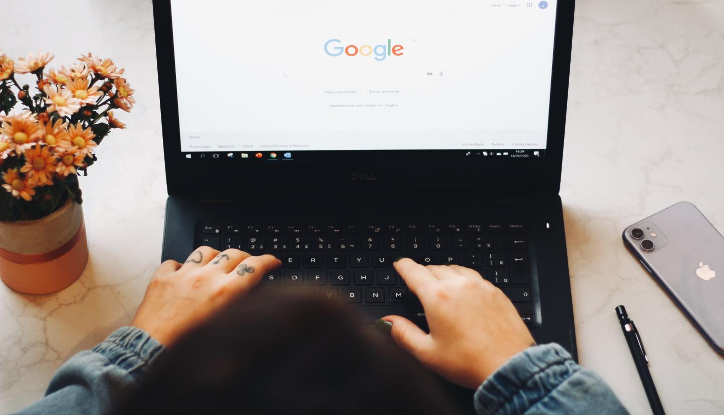 A person using Google on their laptop