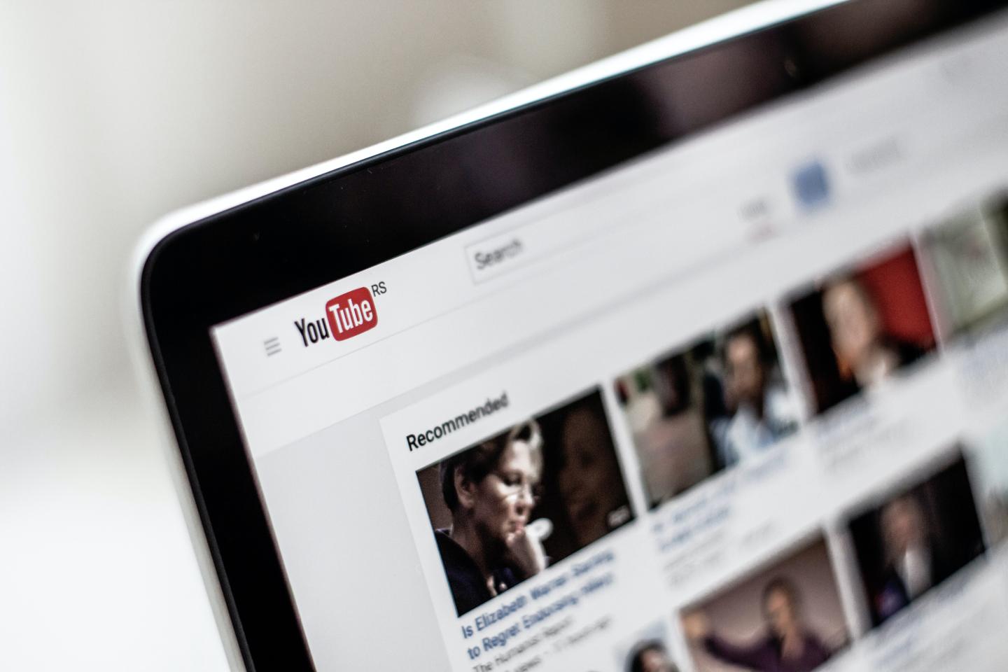 A close up of a laptop screen showing a YouTube page