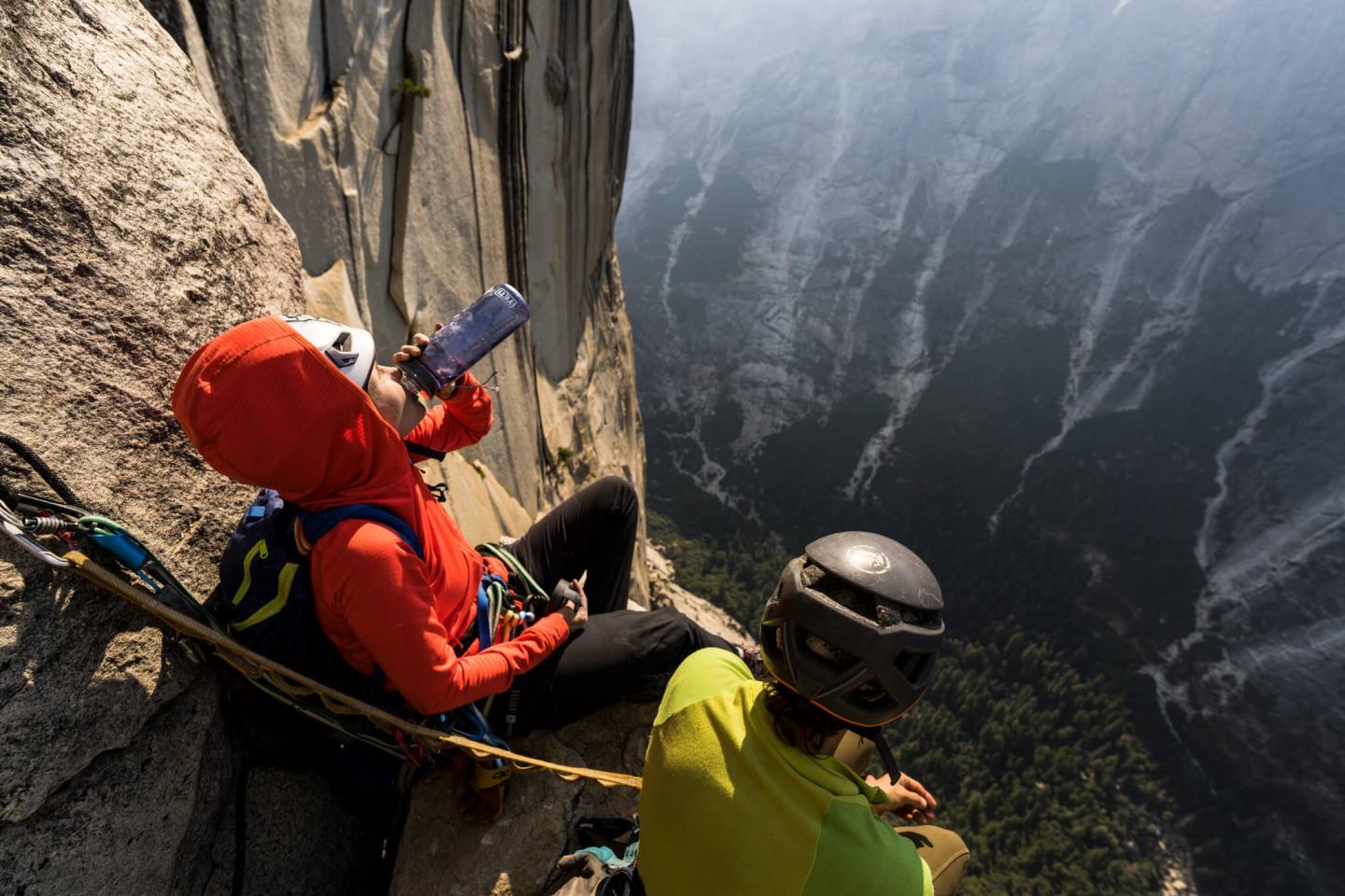 Two climbers on the edge of a mountain