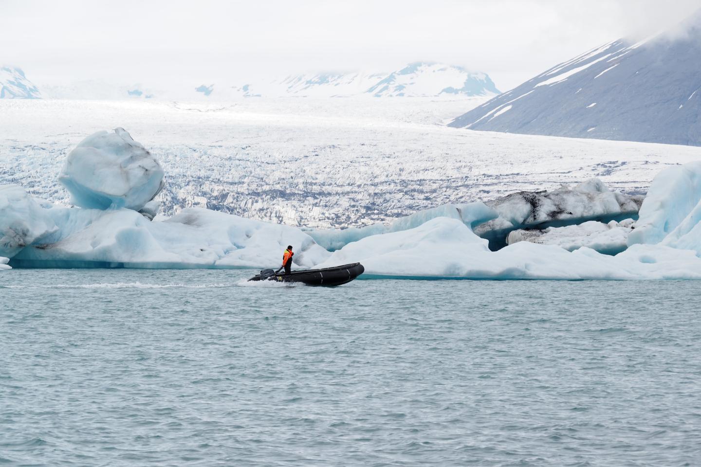 motor boat among glaciers