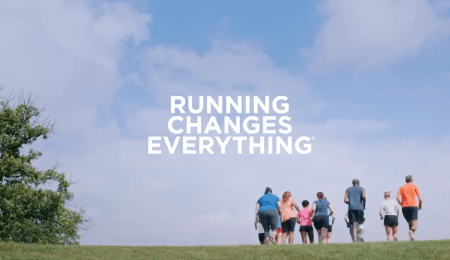group of runners with text "running changes everything"