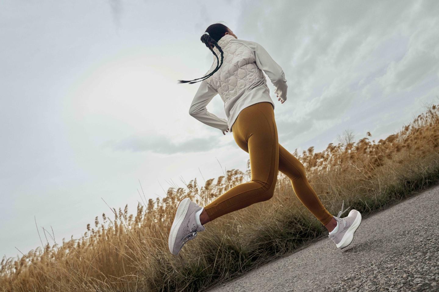 Image of a runner in Saucony's new Triumph RFG - their most sustainable shoe.