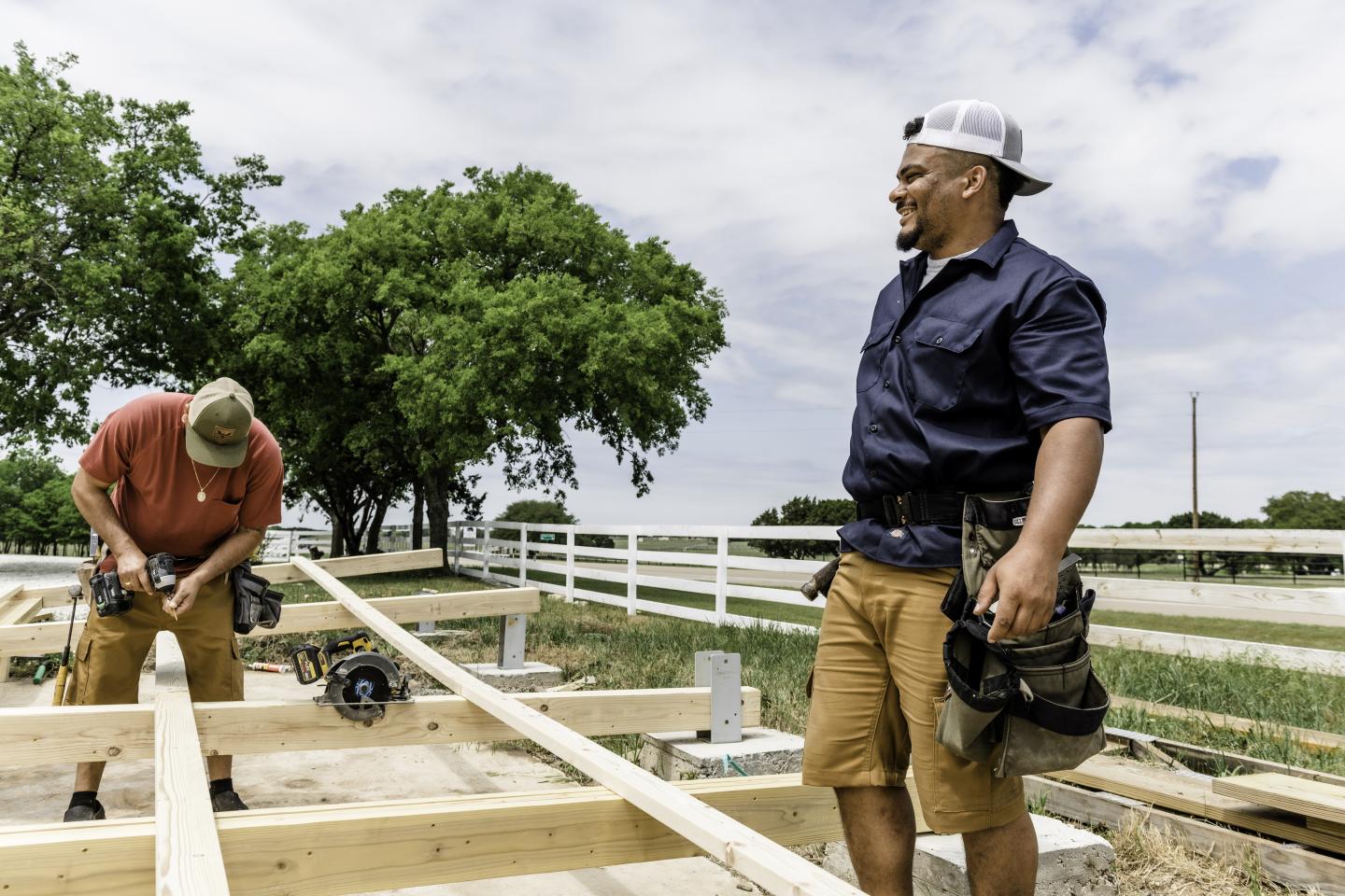 Two people working on a construction site