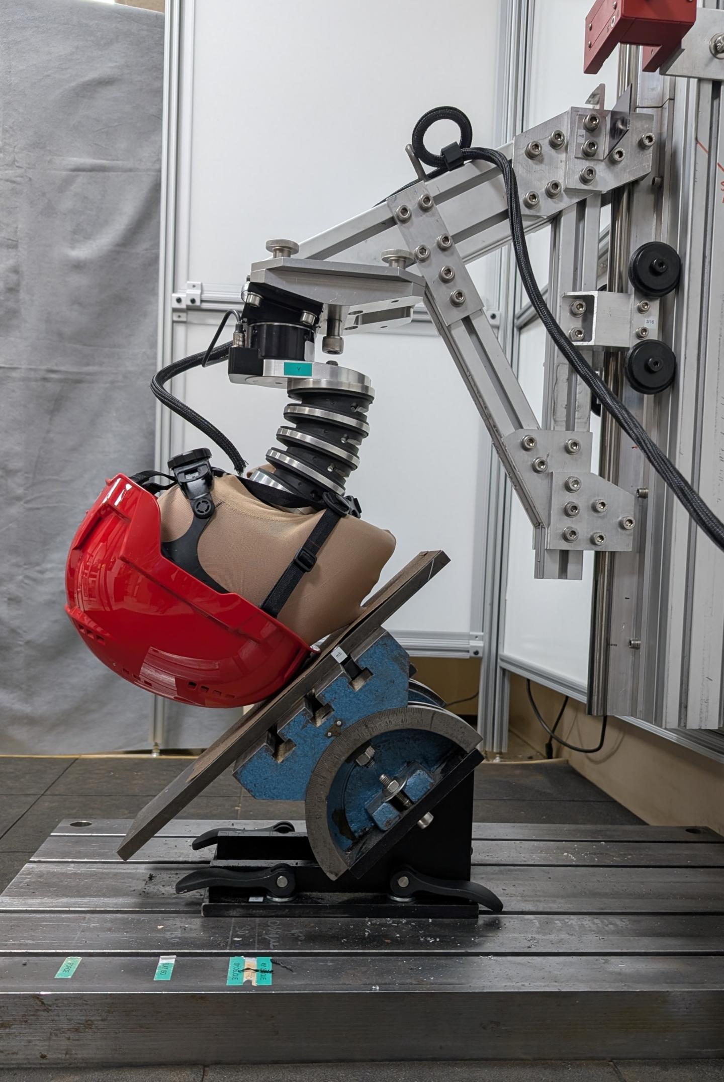 Helmet being tested for rotational acceleration (oblique impact).