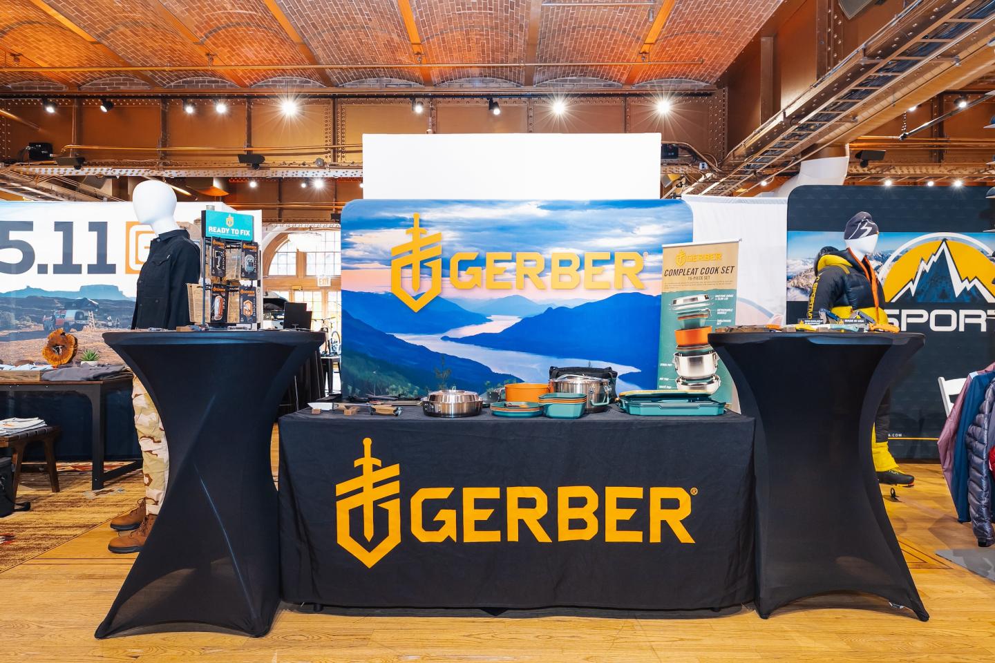 Gerber booth at a trade show with branded table and banners.